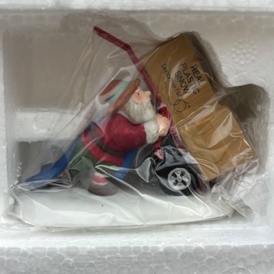 LOT 143: Village Accessories by Dept 56: Delivering Real Plastic Snow, Santa in the City, Elves on Track, Photo w/Santa, Tangles in...