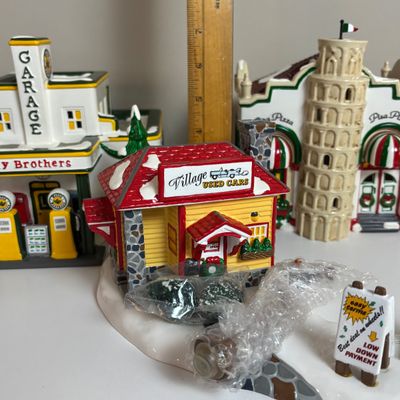 LOT 82: Dept 56 Snow Village Collection: Holly Brothers Garage, Pisa Pizza & Village Used Car Lot