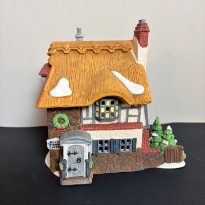 LOT 87: Dept 56 Dickens Village Houses w/Original Boxes: Leacock Poultry, Peggotty's Seaside Cottage, Betsy Trotwood's Cottage