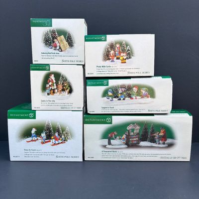 LOT 143: Village Accessories by Dept 56: Delivering Real Plastic Snow, Santa in the City, Elves on Track, Photo w/Santa, Tangles in...