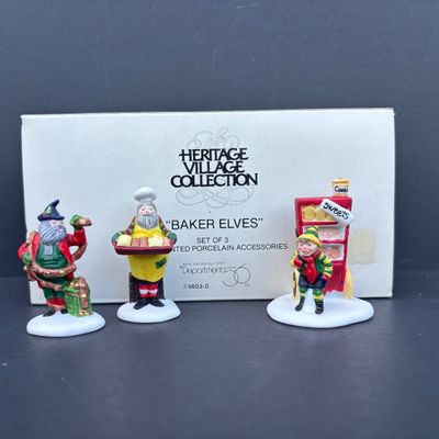 LOT 81: Dept 56 Accessories w/Original Boxes: Trimming the North Pole, Transport, Charting Santa's Course, Baker's Elves, One...