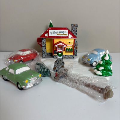 LOT 82: Dept 56 Snow Village Collection: Holly Brothers Garage, Pisa Pizza & Village Used Car Lot