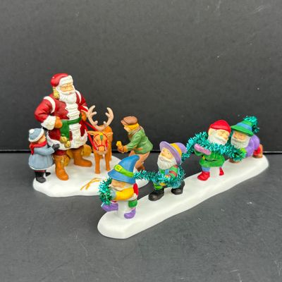 LOT 143: Village Accessories by Dept 56: Delivering Real Plastic Snow, Santa in the City, Elves on Track, Photo w/Santa, Tangles in...