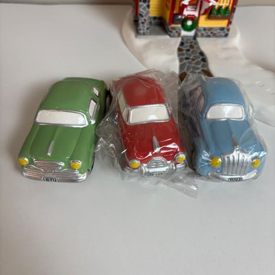 LOT 82: Dept 56 Snow Village Collection: Holly Brothers Garage, Pisa Pizza & Village Used Car Lot