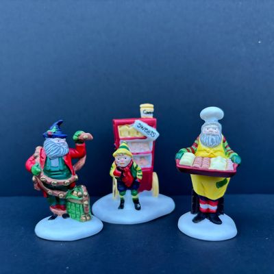 LOT 75: Dept 56 Accessories w/Original Boxes: Busy Sidewalks, Baker Elves, Tis the Season, Carolers on the Doorstep, Toymaker Elves * One...