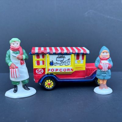LOT 79: Dept 56 Accessories w/Original Boxes: Popcorn Vendor, Dickens' Carolers, Last Minute Delivery, All Around the Town,...