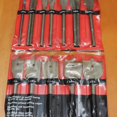 Vintage Craftsman 12-piece power wood boring spade drill bit set in its original red and black plastic pouch, made in the USA.