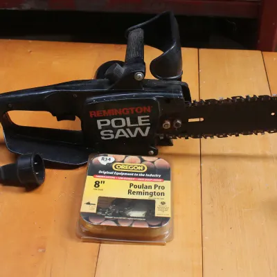 Remington electric pole saw head with an Oregon 8-inch replacement saw chain, showing some wear from use.