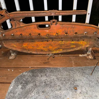 Vintage Specialty Tool Mfg. Co. "The Improved Handy" asbestos shingle cutter, featuring a heavy cast iron frame with weathered...