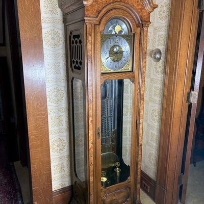 Howard Miller Oak and Burl Oak Triple Chime Grandfather Clock with Moon Phase
