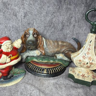 Trio of Vintage Painted Cast Iron Doorstops Including Santa Claus and Basset Hound