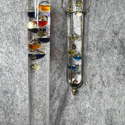 Two Galileo Thermometers Including One in a Hanging Brass Cage