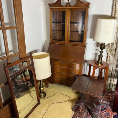 An Assortment of Mahogany and Brass Home Furnishings Including a Serpentine Front Secretary Desk