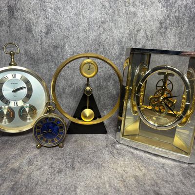 An Assortment of Vintage Bulova, Seiko, and Caravelle Table and Desk Clocks