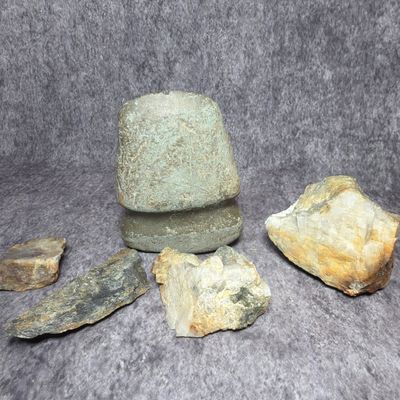 An Assortment of Native American Prehistoric Lithic Artifacts Including a Full Grooved Stone Axe Head