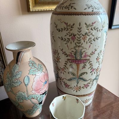 Collection of vintage Asian-style ceramics, featuring a large crackle-glaze vase with floral and bird motifs, a smaller pink vase with a...