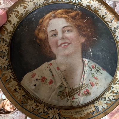 Vintage Edelweiss Beer lithographed tin advertising tray from The Peter Schoenhofen Brewing Co. of Chicago, featuring a portrait of a...