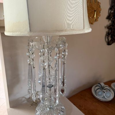 Vintage cut glass table lamp featuring hanging crystal prisms and a cream-colored fabric shade.