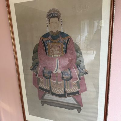 Large framed Chinese ancestor portrait depicting a noblewoman in traditional formal robes, presented under glass in a gilded wooden frame.