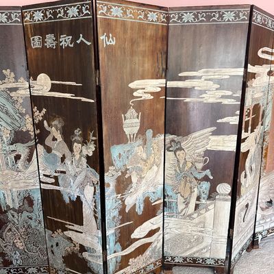 Vintage six-panel Chinese folding floor screen featuring hand-painted and carved details depicting figures in a landscape with...