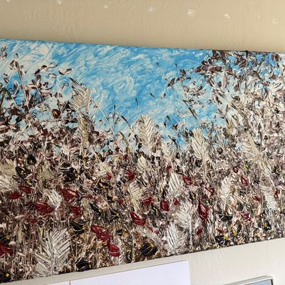 Large horizontal canvas painting featuring a textured, impasto depiction of a field of wildflowers and tall grasses under a blue sky.