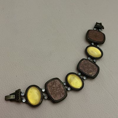 Vintage Brass Link Bracelet with Carved Floral Panels and Yellow Cabochons