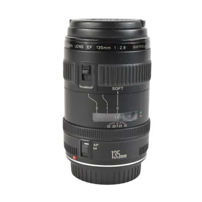 Canon EF 135mm f/2.8 Softfocus prime lens, showing some light exterior wear but appearing in functional condition.