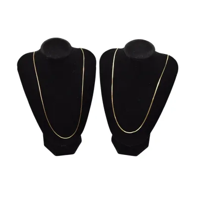 Two fine gold chain necklaces displayed on black velvet bust stands.