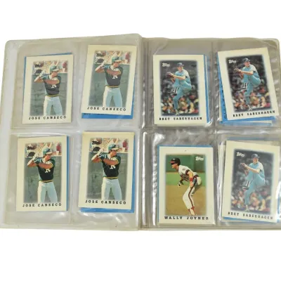 Collection of late 1980s Topps baseball cards, including Jose Canseco, Bret Saberhagen, and Wally Joyner, housed in a clear plastic...