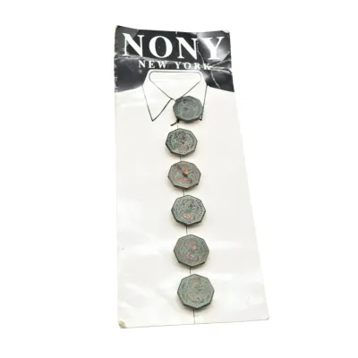 Vintage set of six octagonal metal buttons by Nony New York, featuring embossed classical profiles with a green patina finish, still...