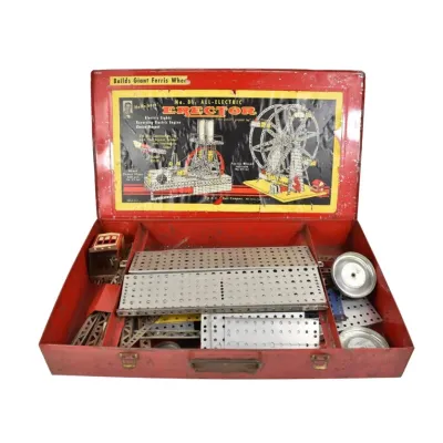 Vintage A.C. Gilbert No. 8 1/2 All-Electric Erector Set in its original red metal tool box, featuring various metal building components...