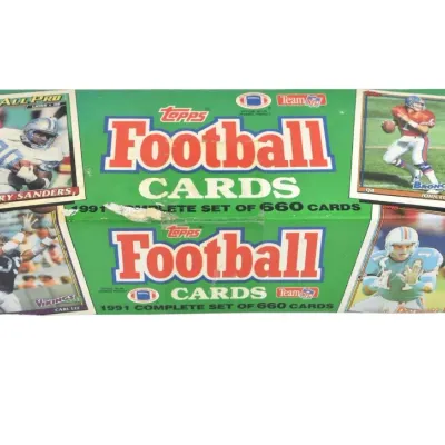 1991 Topps Football Cards complete set of 660 cards in its original green retail box, showing some wear on the packaging.