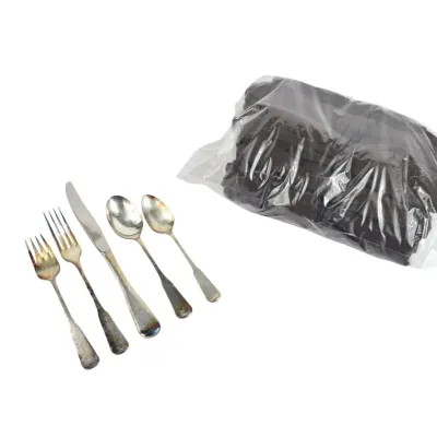 silver-plated flatware set, including forks, a knife, and spoons, shown alongside a sealed plastic bag containing additional pieces.