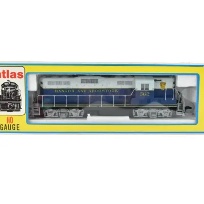 Atlas HO gauge Bangor and Aroostook diesel locomotive model number 562, presented in its original yellow and blue packaging.