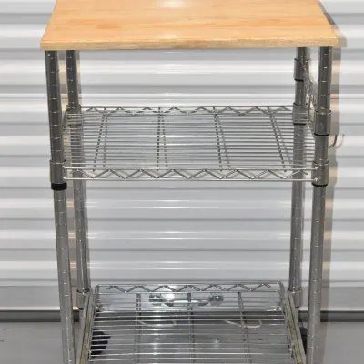Three-tier rolling utility cart featuring a light wood top shelf, two wire shelves, and black caster wheels.