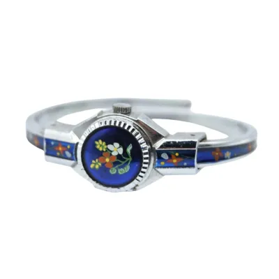 Vintage silver-tone bypass bangle watch featuring a blue enamel face and band accented with hand-painted floral details.