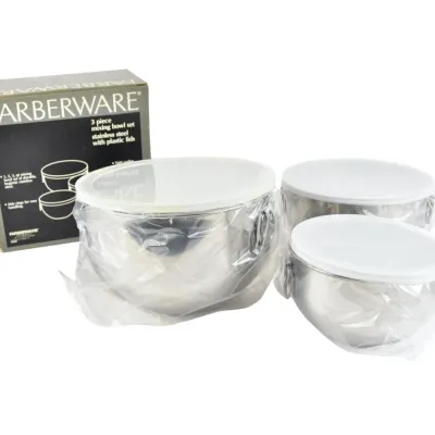 Vintage Farberware three-piece stainless steel mixing bowl set with white plastic lids, new in original box and plastic wrapping.