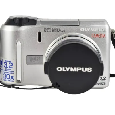 Olympus Camedia C-740 Ultra Zoom digital camera, featuring 3.2 megapixels and a 10x optical zoom lens, complete with lens cap and neck...