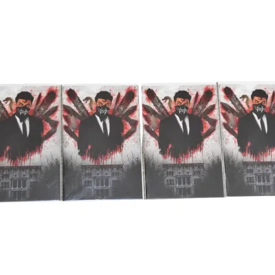 Four copies of a horror-themed comic book or graphic novel, featuring a masked man in a suit on the cover, in protective plastic sleeves.