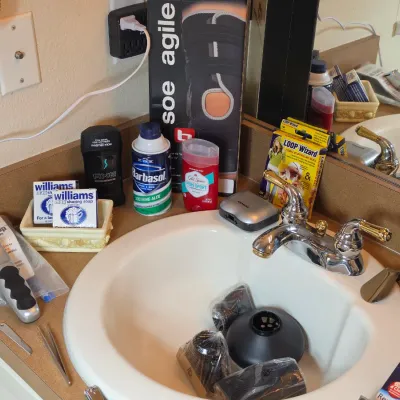 Assorted personal care and grooming items, including a Wahl Touch Up trimmer, Barbasol shaving cream, Williams shaving soap, and a boxed...