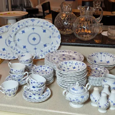 Vintage Royal Copenhagen Blue Fluted Half Lace porcelain dinnerware set, including platters, plates, bowls, teacups, saucers, a creamer,...