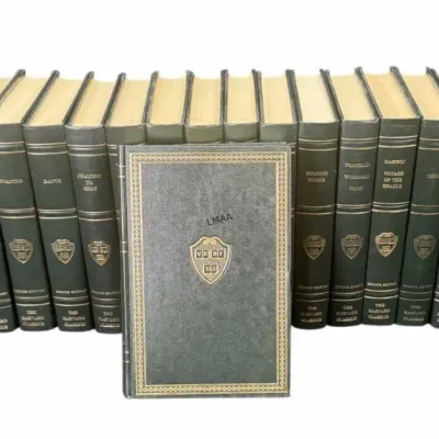 Vintage collection of The Harvard Classics hardcover books, featuring dark green covers with gold gilt lettering and the Harvard crest on...