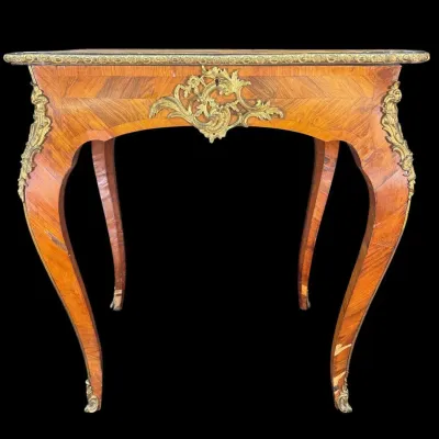 French Louis XV style parquetry side table featuring cabriole legs, ornate ormolu mounts, and a brass-banded top.