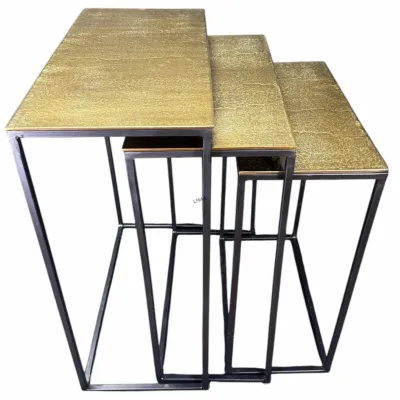 Set of three nesting tables featuring textured gold-finished tops and minimalist black metal frames.
