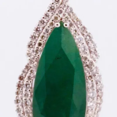 Pear-cut green emerald pendant set in a white gold or platinum halo frame embellished with small round-cut diamonds.