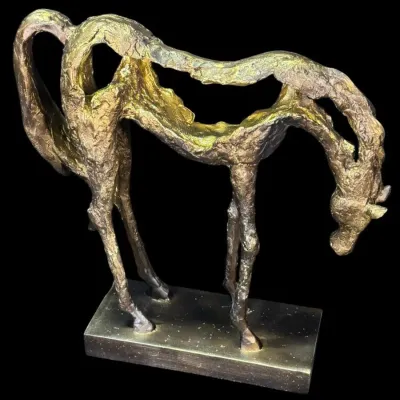 Mid-century modern style abstract horse sculpture with a textured, open-frame design and a metallic gold finish, mounted on a rectangular...