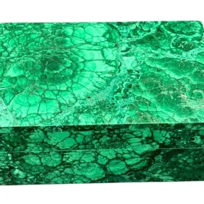 Vintage malachite veneered jewelry or trinket box, featuring vibrant green banded patterns and a rectangular hinged lid.