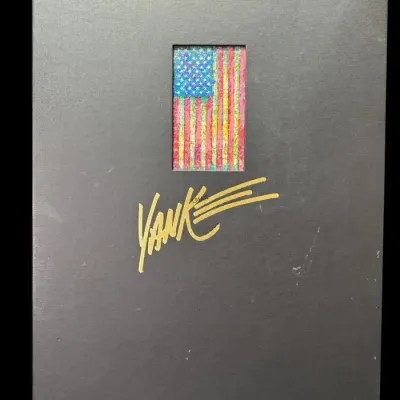 Yankee magazine special edition book or portfolio, featuring a textured American flag insert and a gold-embossed signature on a black cover.