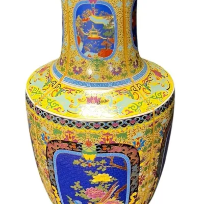 Large Chinese cloisonné or enameled porcelain floor vase, featuring intricate floral and landscape panels on a vibrant yellow ground with...