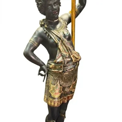 Antique Venetian blackamoor torchier statue, featuring a hand-painted figure holding a gilded staff on a square pedestal base.